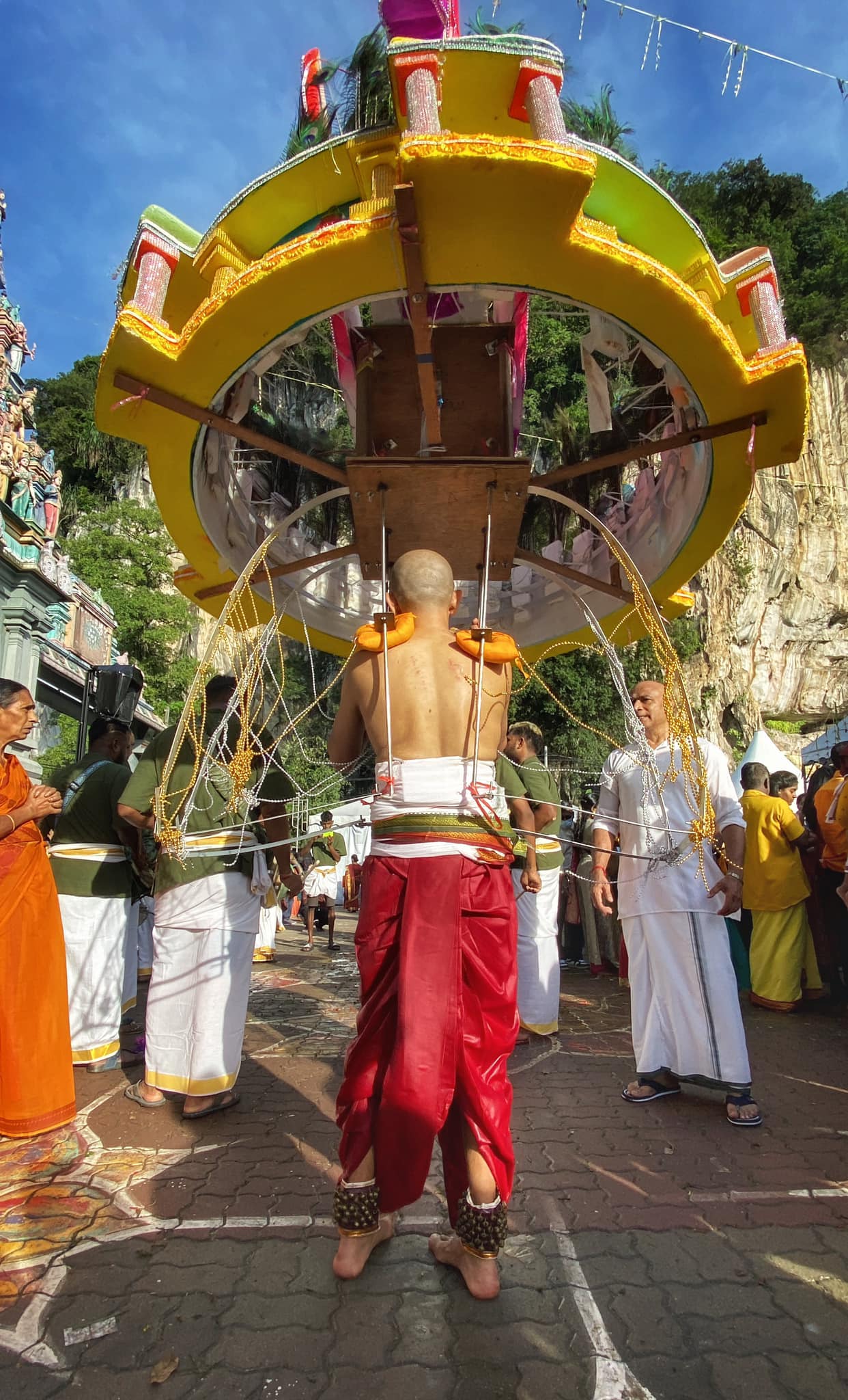 A Hindu devotee carries a kavadi during Thaipusam at Kallumalai Temple, Ipoh, Perak